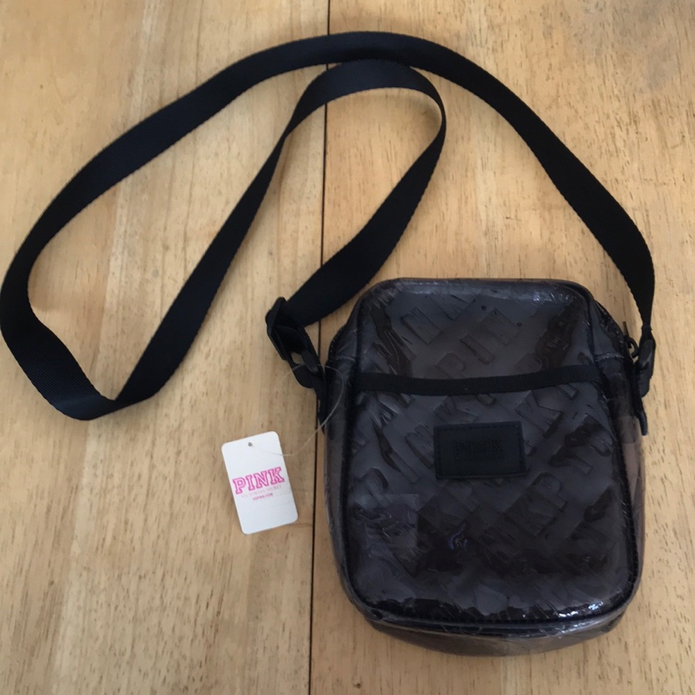 Victoria Secret crossbody bag. adjustable strap, zipper, and outer pocket